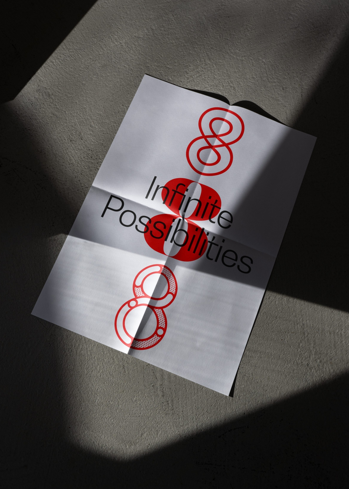 Foldout poster with Infinite Possibilities strapline and three 8 graphic numbers