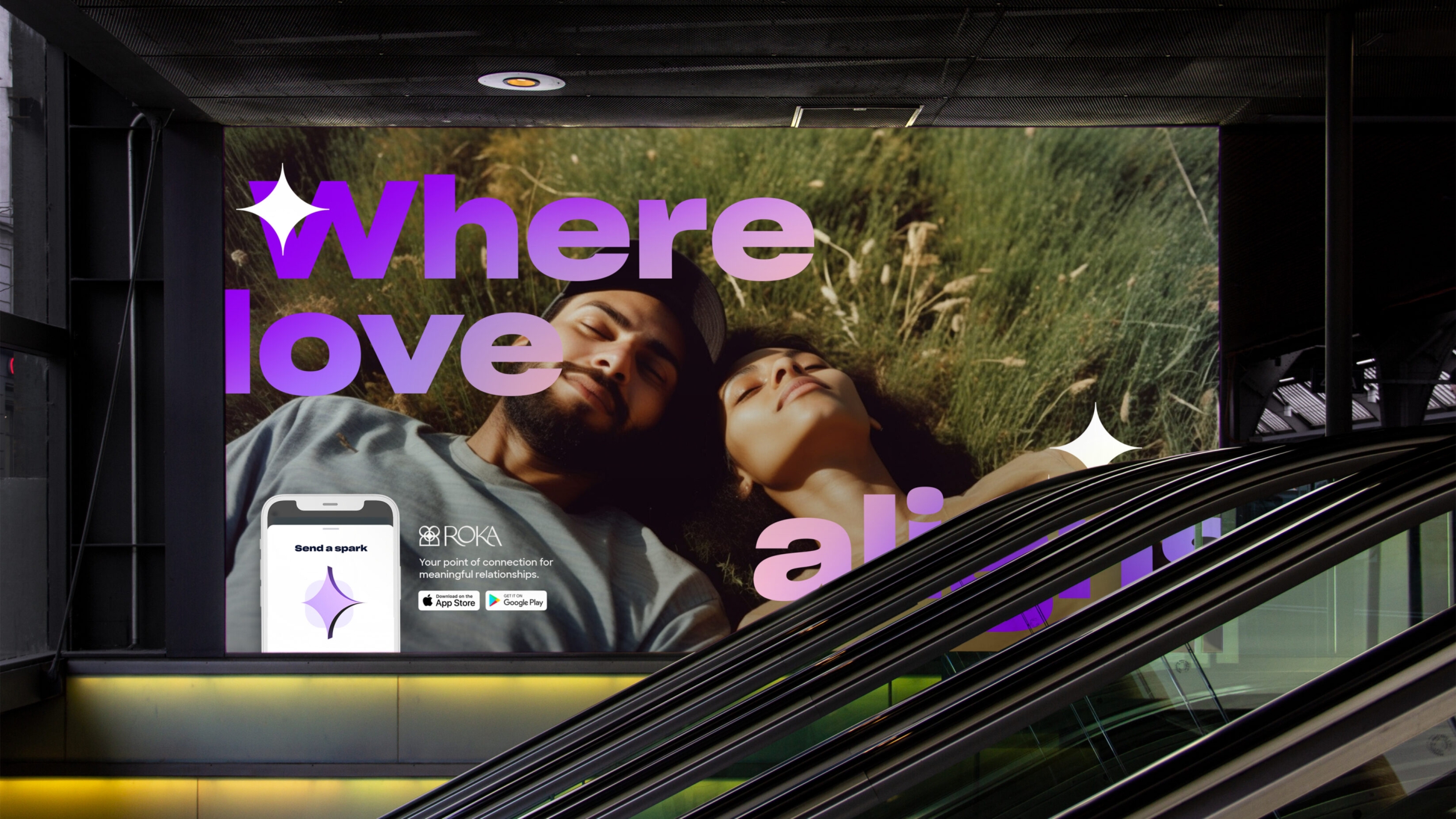 Large 'where love alins' text overlaid onto a content couple laying in the grass, shown in a digital billboard