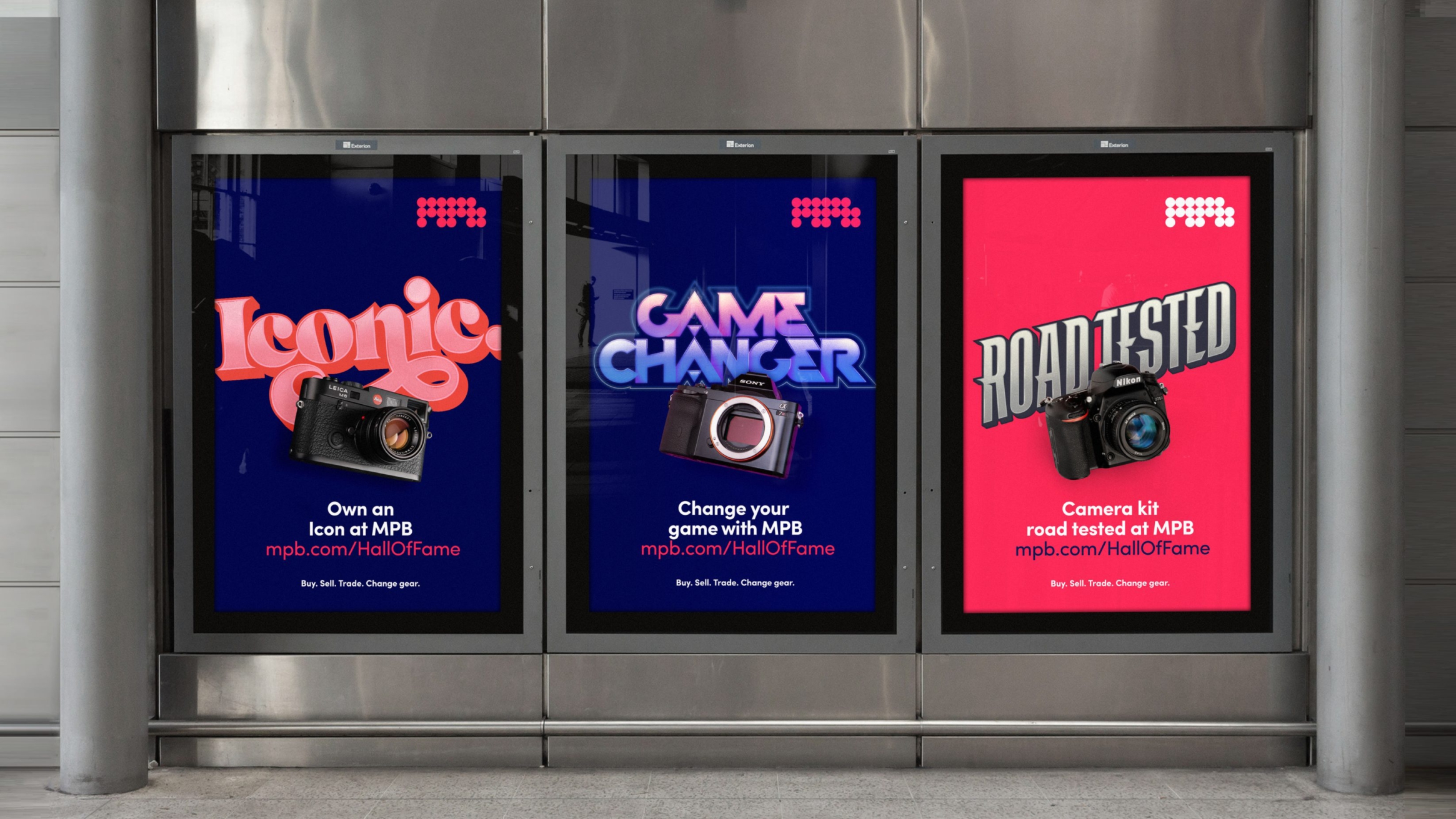 A triad of billboards each with a different vintage camera and the words 'iconic', 'game changer' or 'road tested' in various font-styles
