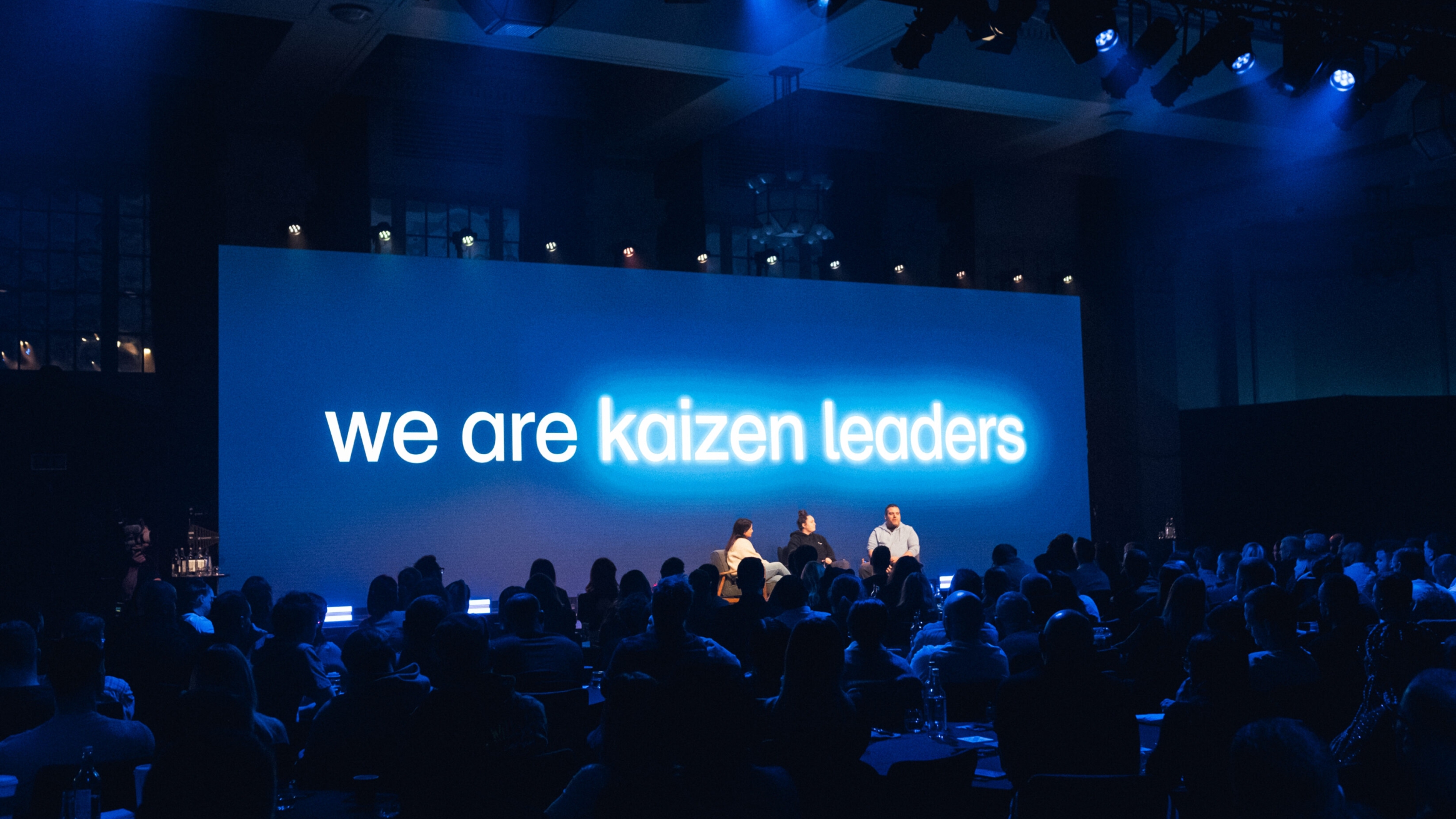 The wagamama employer brand proposition on a big screen at their annual conference - we are kaizen leaders